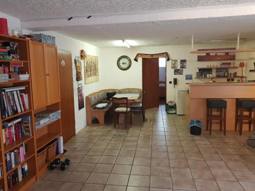 a kitchen and dining room with a table and a room with at Ferienwohnung und Monteurwohnung mit großer begehbarer Dusche in Lünen