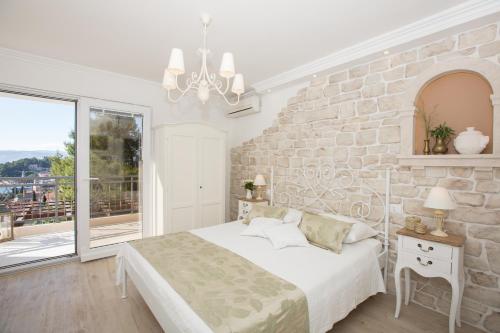 Ένα ή περισσότερα κρεβάτια σε δωμάτιο στο Villa la Perla