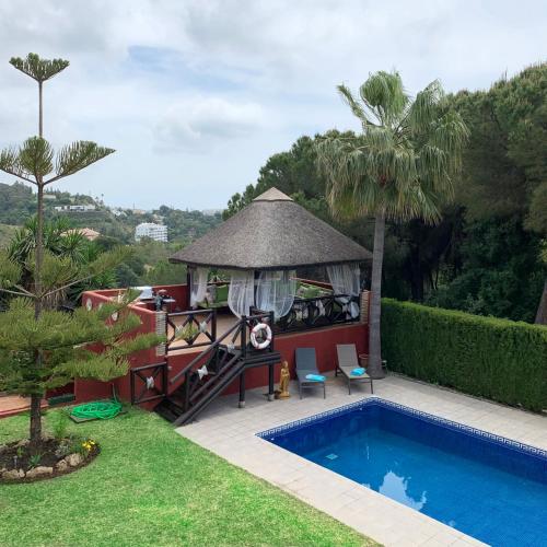a resort with a gazebo and a swimming pool at VILLA NABRISA MARBELLA, 5 BEDROOM, PRIVATE POOL, GARDEN, BBQ in Marbella
