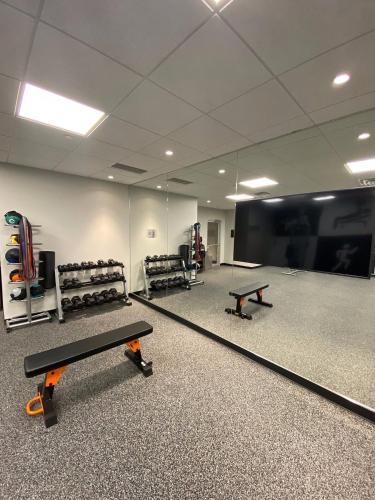 a gym with two ping pong tables in a room at Best Western Premier Prince Albert in Prince Albert
