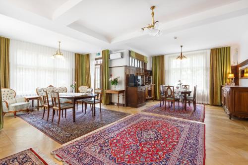 a living room with a table and chairs at Villa Meri in Pärnu