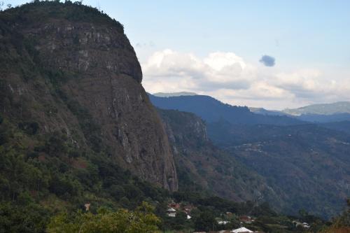 a view of a mountain with a town at the bottom at LUSHOTO EXECUTIVE LODGE in Lushoto