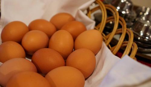a basket filled with brown eggs on a table at Hotel Weissenstein in Sankt Michael im Lungau