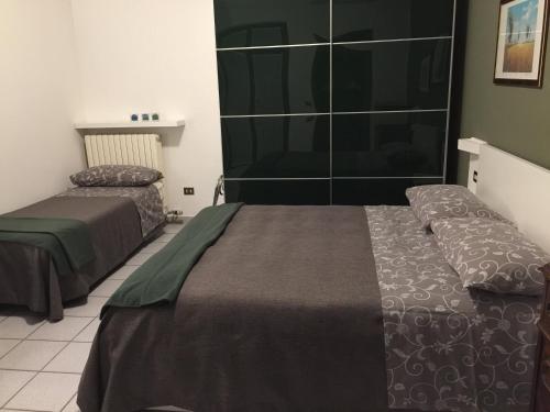 a hotel room with two beds in a room at 3per3 in Busto Arsizio