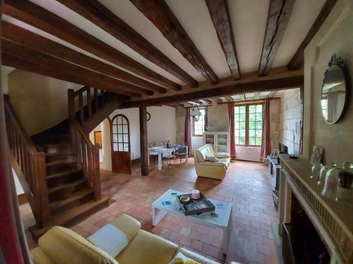 an overhead view of a living room with a staircase at Gîte Au près du Lys in Saint-Martin-le-Beau