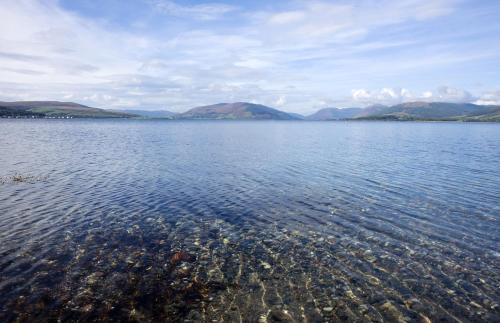 a large body of water with mountains in the background at The Glenburn Hotel in Rothesay