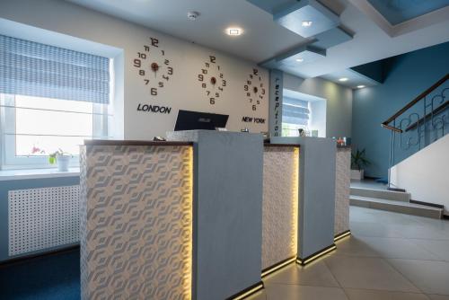 a lobby with a reception desk in a building at Rhombus Hotel in Luts'k