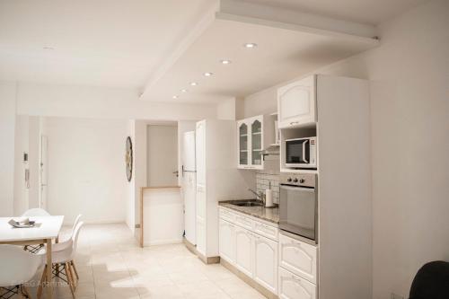 Een keuken of kitchenette bij G&G Apartments - Obelisco Perfect location