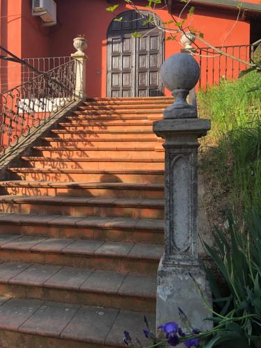 a set of stairs in front of a house at Charme of Villa Capannina in Novi Ligure