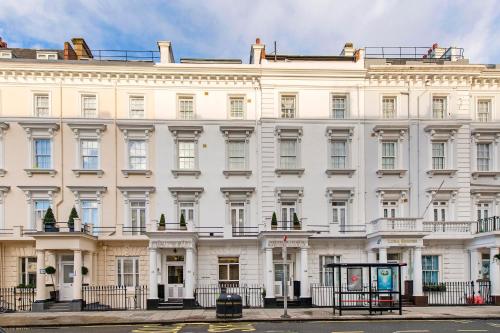 a large white building with a lot of windows at Lidos Hotel in London