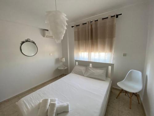 Krevet ili kreveti u jedinici u okviru objekta Orphanides Latchi Apartment