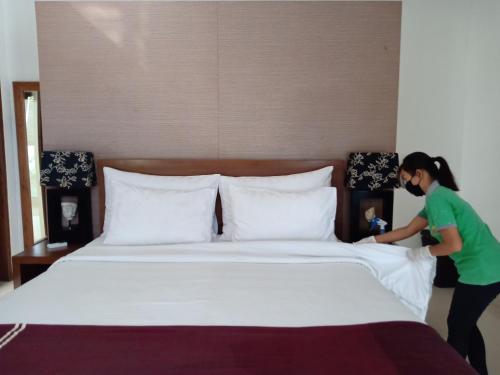A bed or beds in a room at Grania Bali Villas