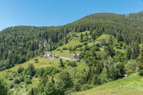 an aerial view of a house on a hill at Baita Serpillo in Palù del Fersina