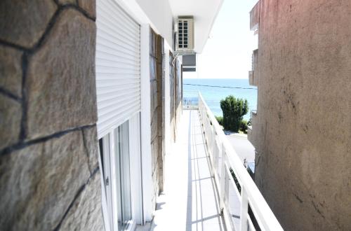a balcony of a building with a view of the ocean at Oceanview 1 in Nea Kalikratia