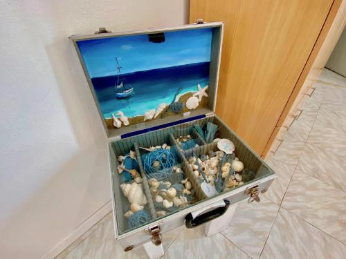 a box filled with shells in a room at Villa Doma with private pool for up to 29 guests by DadoVillas in Roda