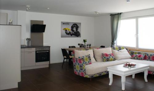 a living room with a couch and a table at unique flat in Düsseldorf