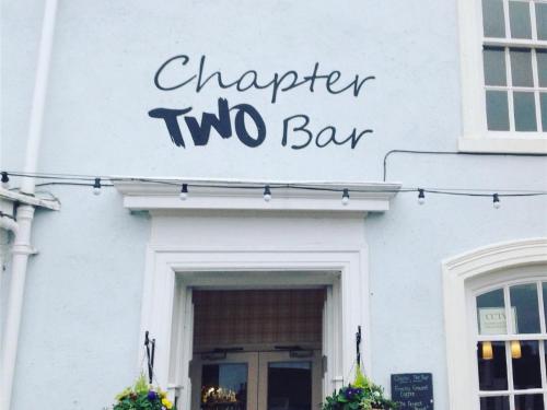 a white building with a sign that reads chapter two bar at Chapter Two Bar in Malton