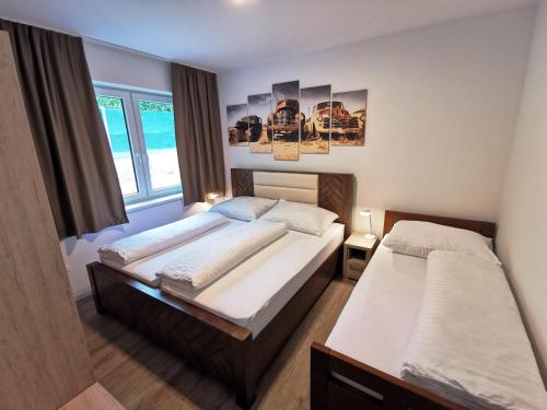 מיטה או מיטות בחדר ב-Bojnice Krásna Poruba