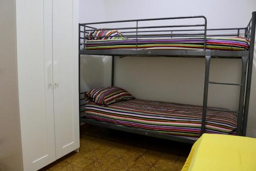 a couple of bunk beds in a room at Il rifugio di Elena in Maiori