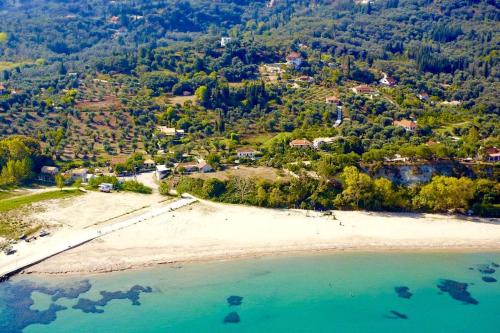 an aerial view of a beach with a resort at Villa Doma with private pool for up to 29 guests by DadoVillas in Roda