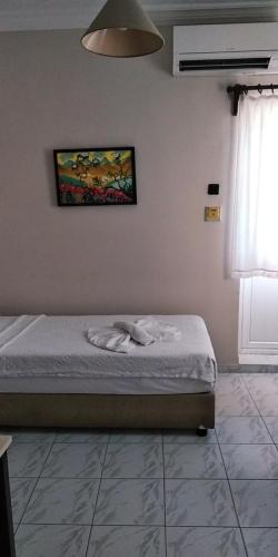 Katil atau katil-katil dalam bilik di Ladies Beach Hotel