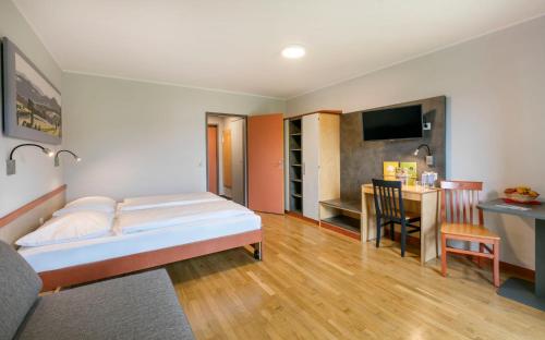 Postel nebo postele na pokoji v ubytování JUFA Hotel Vulkanland