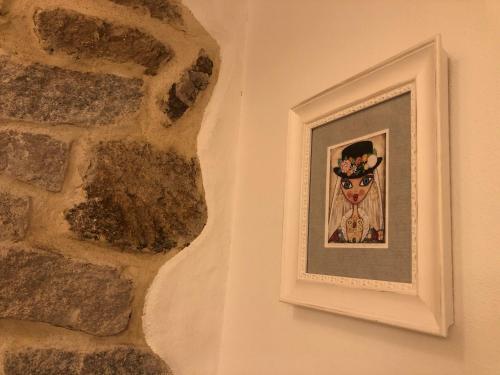 a picture of a cow hanging on a wall at La Dimora di San Simplicio in Olbia