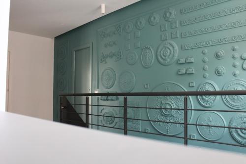 a wall with plates on it in a room at Il Cavaliere Bed and Breakfast in Caserta