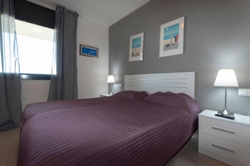 A bed or beds in a room at 1112 Mileni I - Apivend Immo