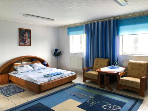 Hotel Kowalski tesisinde bir odada yatak veya yataklar