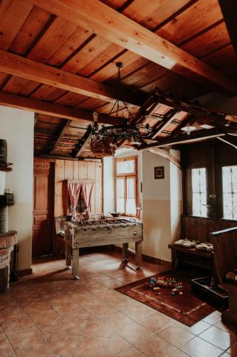 a room with a pool table in the middle of it at RANČ JUREŠ in Ljutomer