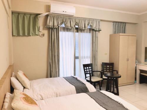 A bed or beds in a room at Chia Yun Homestay