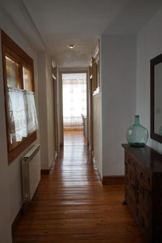 a hallway of a home with a wooden floor at Apartamento «El Balcón de la Calle Mayor» in Jaca