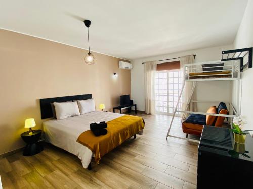 a bedroom with a bed and a bunk bed at Stay on Top Old Town in Lagos