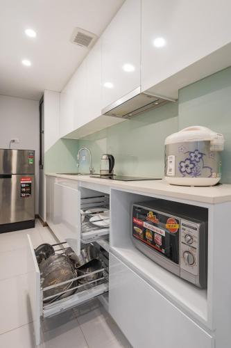 a kitchen with a counter with an open oven at Narcissus Hotel & Apartment in Hanoi