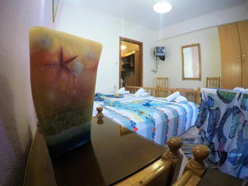 a bedroom with a bed with a cross on it at Elizabeth Hotel in Kallithea Halkidikis