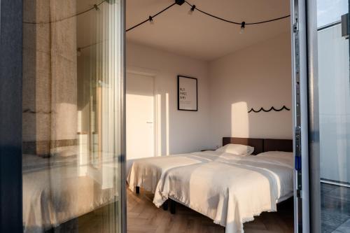 Ein Bett oder Betten in einem Zimmer der Unterkunft Łydynia