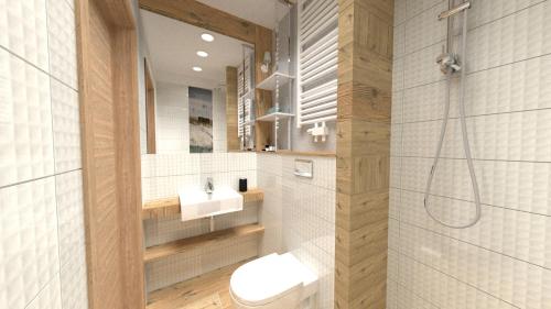 a bathroom with a toilet and a sink and a shower at Dom Wczasowy Beskidy in Wisła