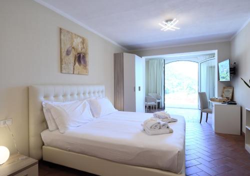 Ένα ή περισσότερα κρεβάτια σε δωμάτιο στο Agriturismo Il Colle