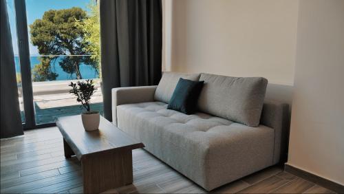 a living room with a couch and a coffee table at Casa Bloo Adults Only in Elia