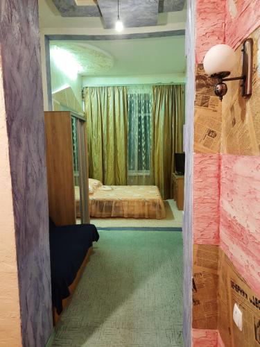 Llit o llits en una habitació de Курорт Куяльник