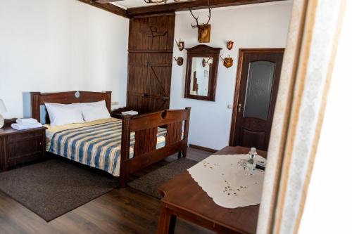Ένα ή περισσότερα κρεβάτια σε δωμάτιο στο Hotel Lubych