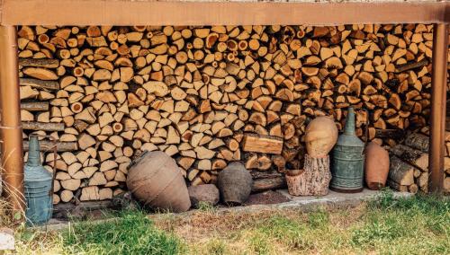 a pile of wood stacked on top of each other at Hayi Tun Guest House in Goris
