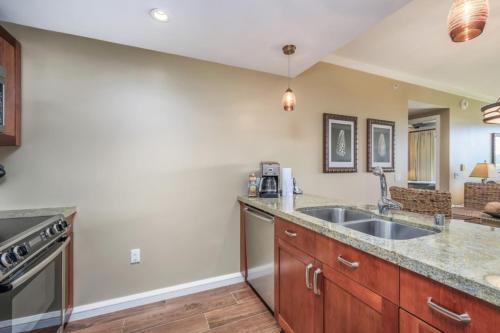 a kitchen with a sink and a stove at Maui Westside: Honua kai Konea 312/314 in Kaanapali