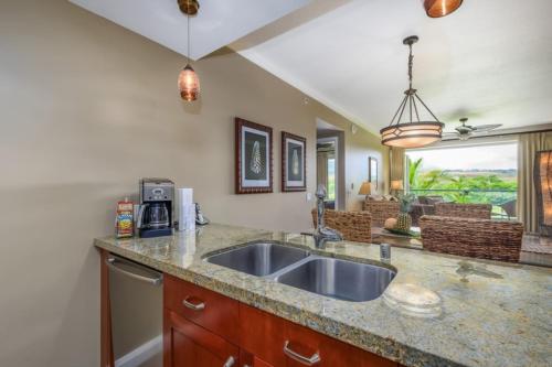 a kitchen with a sink and a counter top at Maui Westside: Honua kai Konea 312/314 in Kaanapali