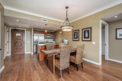 a kitchen and dining room with a table and chairs at Maui Westside: Honua kai Konea 312/314 in Kaanapali