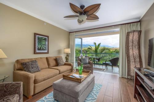 a living room with a couch and a ceiling fan at Maui Westside: Honua kai Konea 312/314 in Kaanapali