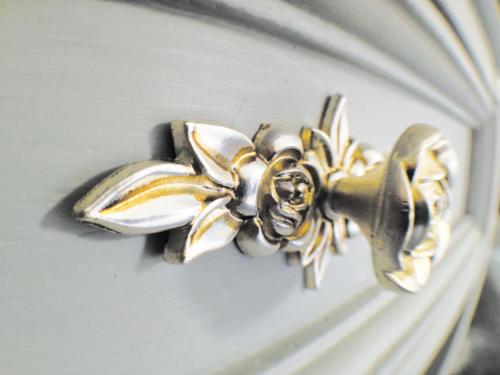 a gold door knob with a flower on it at Hillside Bed and Breakfast in Crediton