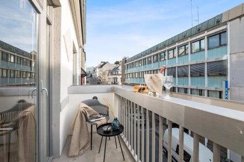 a balcony with a view of a building at Aalesund City Apartment in Ålesund