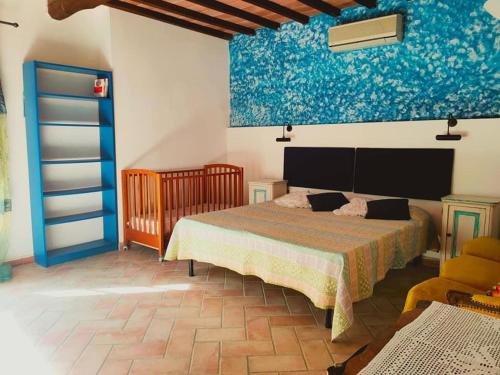 A bed or beds in a room at Podere le Muricce